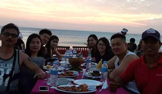 sunset in uluwatu temple with bali essential tour package service